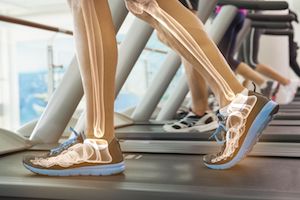 legs walking on treadmill