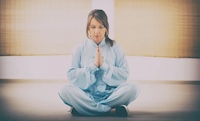 woman sitting in lotus position
