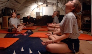 soldiers sitting in tent meditating