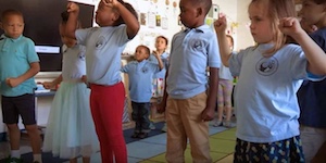 little kids in classroom standing